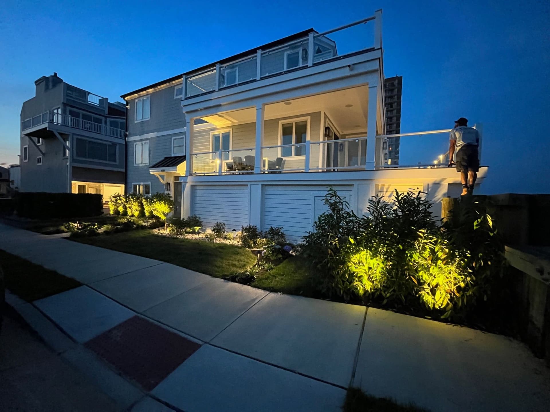 Coastal custom residence illuminated at dusk